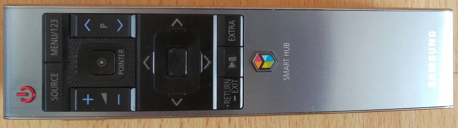 Pohybový dálkový ovladač. Kurzor vyvoláte dotykem tlačítka s tečkou.